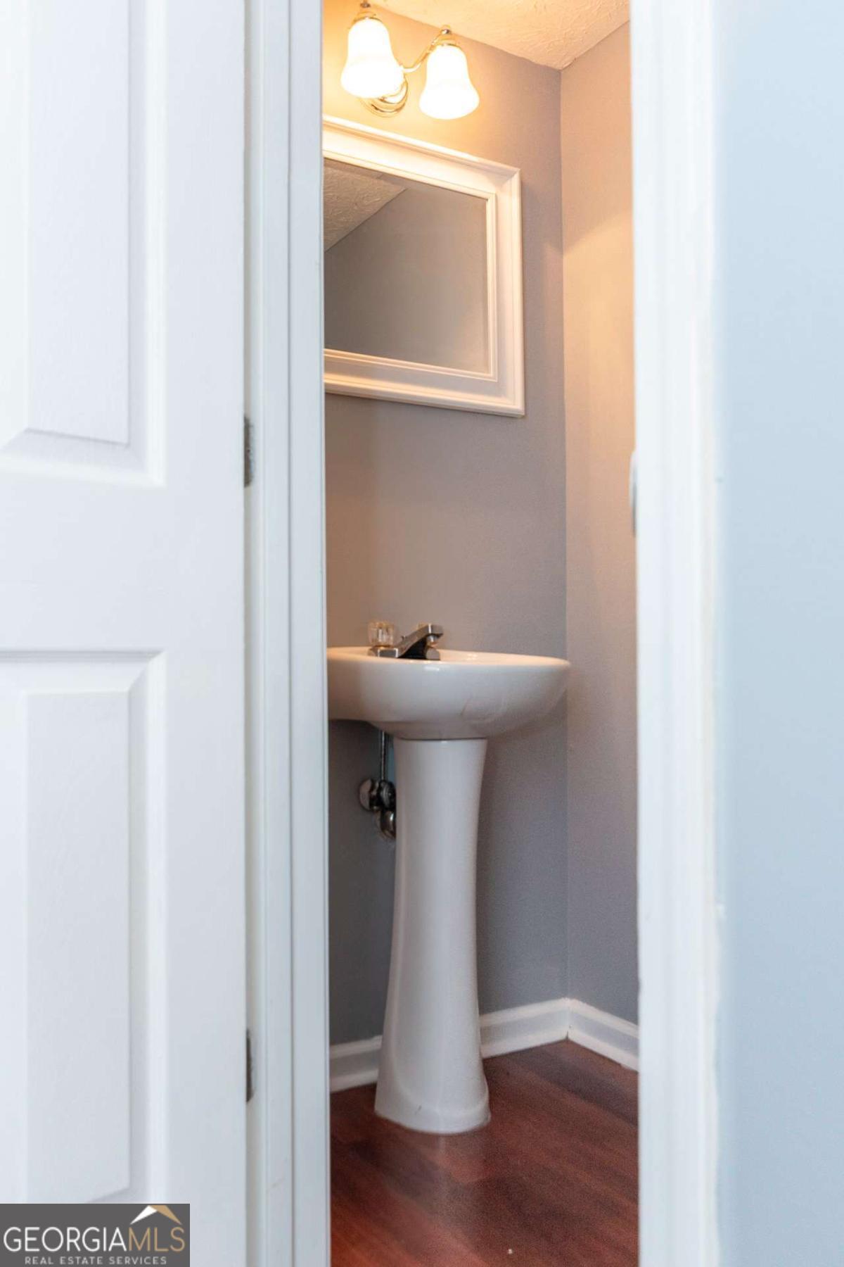 4123 Stone Trace Drive East Point, GA 30344 - Photo 19 of 24 a bathroom with a sink and a mirror