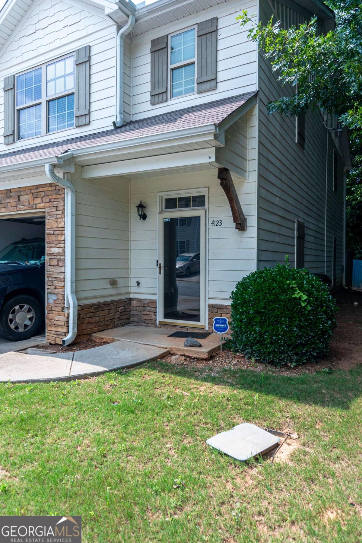 4123 Stone Trace Drive East Point, GA 30344 - Photo 2 of 24 a view of a backyard with a barbeque grill and plants