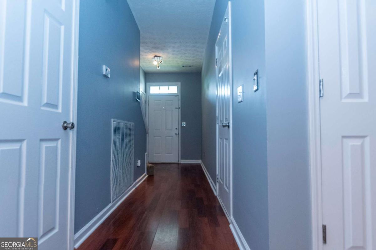 4123 Stone Trace Drive East Point, GA 30344 - Photo 22 of 24 a view of a hallway with wooden floor