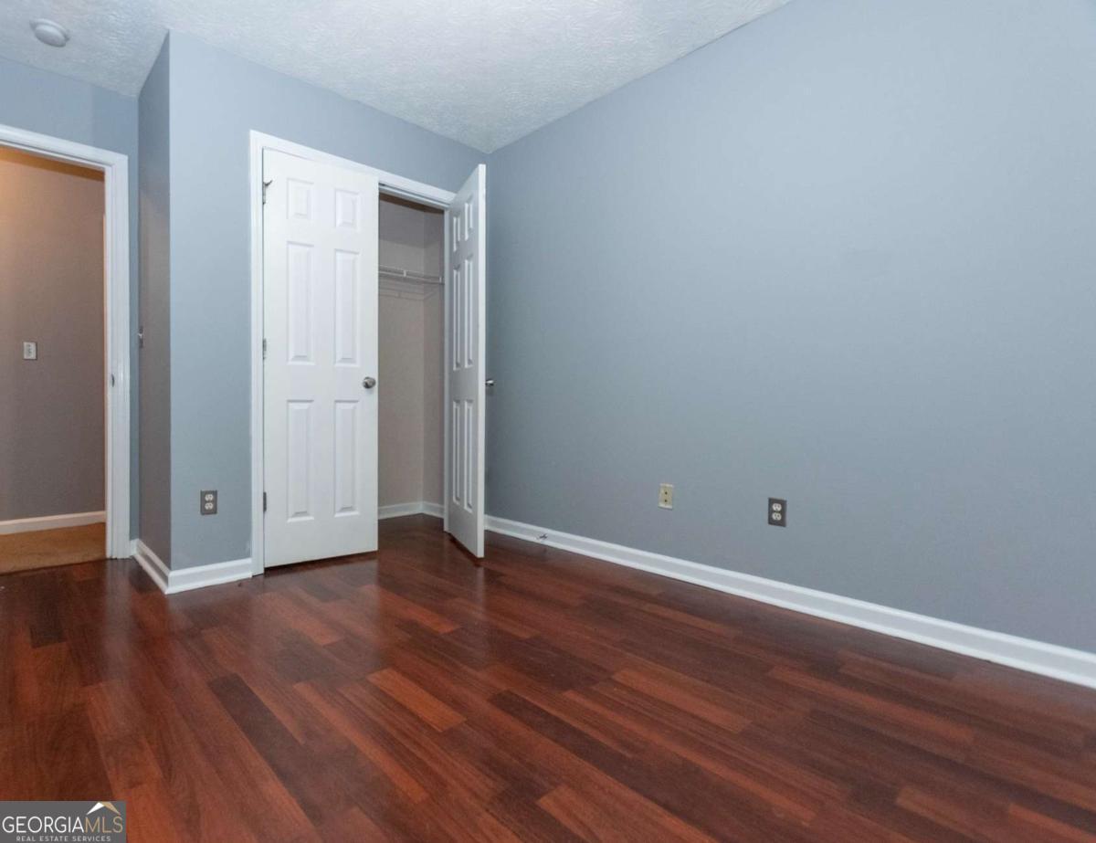 4123 Stone Trace Drive East Point, GA 30344 - Photo 7 of 24 a view of an empty room with wooden floor