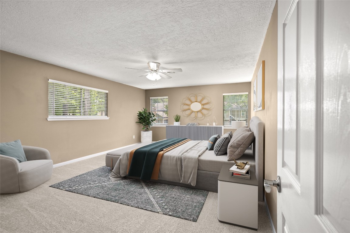 24915 Butterwick Drive Spring, TX 77389 - Photo 11 of 20 Retreat to your primary oasis! This massive bedroom offers room for a sitting area and features large windows for a bright, airy feel. VIRTUALLY STAGED