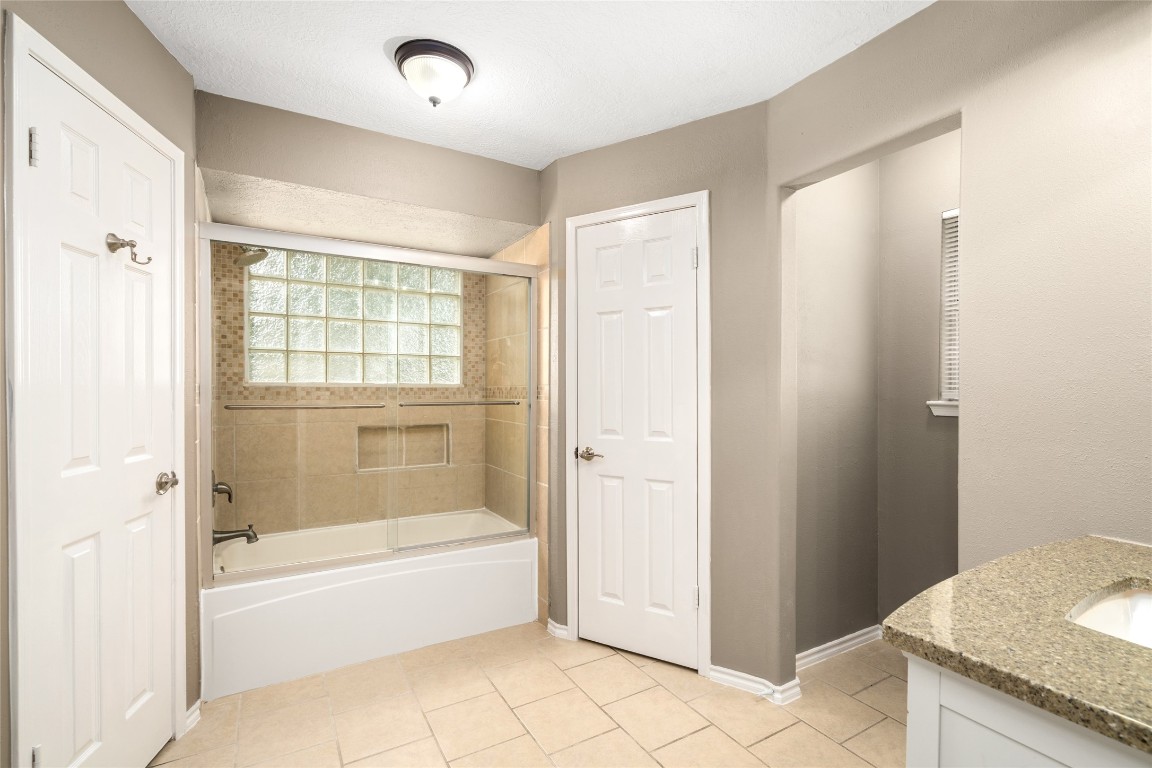 24915 Butterwick Drive Spring, TX 77389 - Photo 12 of 20 Spa day at home! Your primary bath features a large tub and a separate glass-enclosed shower, designed for your total relaxation.