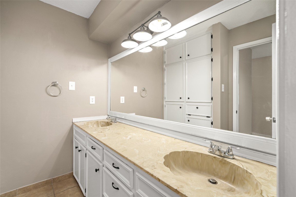 24915 Butterwick Drive Spring, TX 77389 - Photo 16 of 20 You have all the room you need to get ready! This updated bathroom features a long double vanity and plenty of storage.