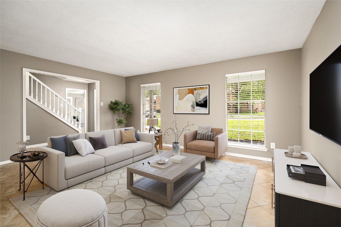 24915 Butterwick Drive Spring, TX 77389 - Photo 4 of 20 Your formal living room is bathed in natural light! It’s the perfect, versatile space for your piano, a home library, or a sophisticated sitting area. VIRTUALLY STAGED