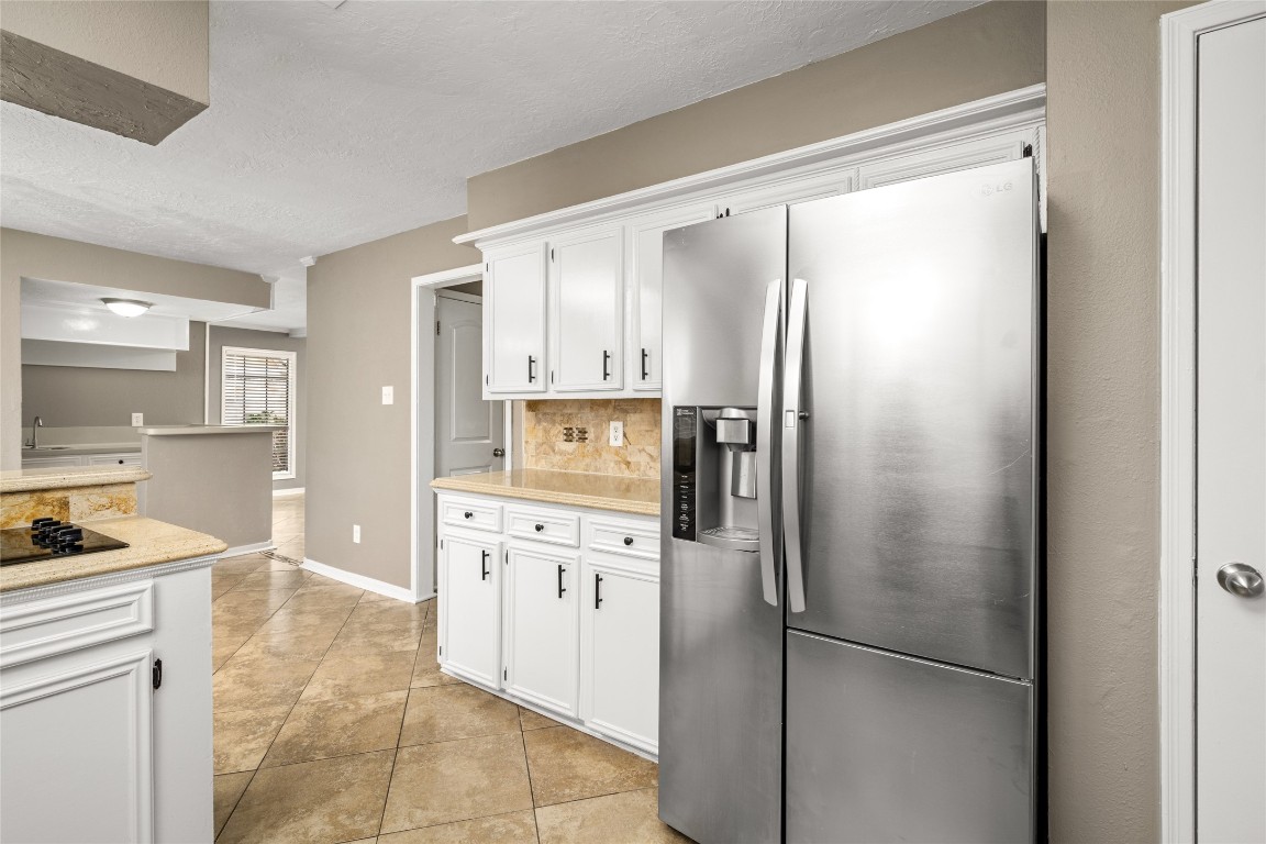 24915 Butterwick Drive Spring, TX 77389 - Photo 6 of 20 Storage galore! Your kitchen provides plenty of cabinet space and a direct view of the breakfast area, keeping you connected to the family.