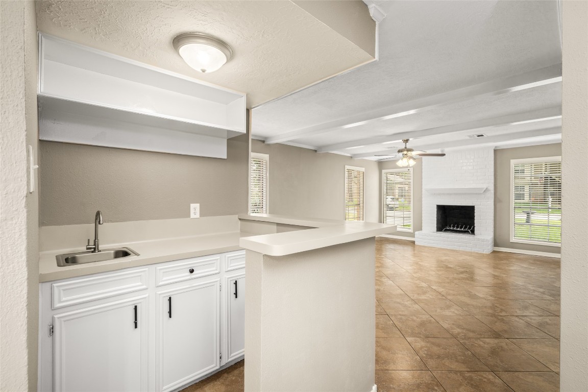 24915 Butterwick Drive Spring, TX 77389 - Photo 8 of 20 Your entertaining game just leveled up! This built-in wet bar perfectly serves your family room, making movie nights or game days a breeze.