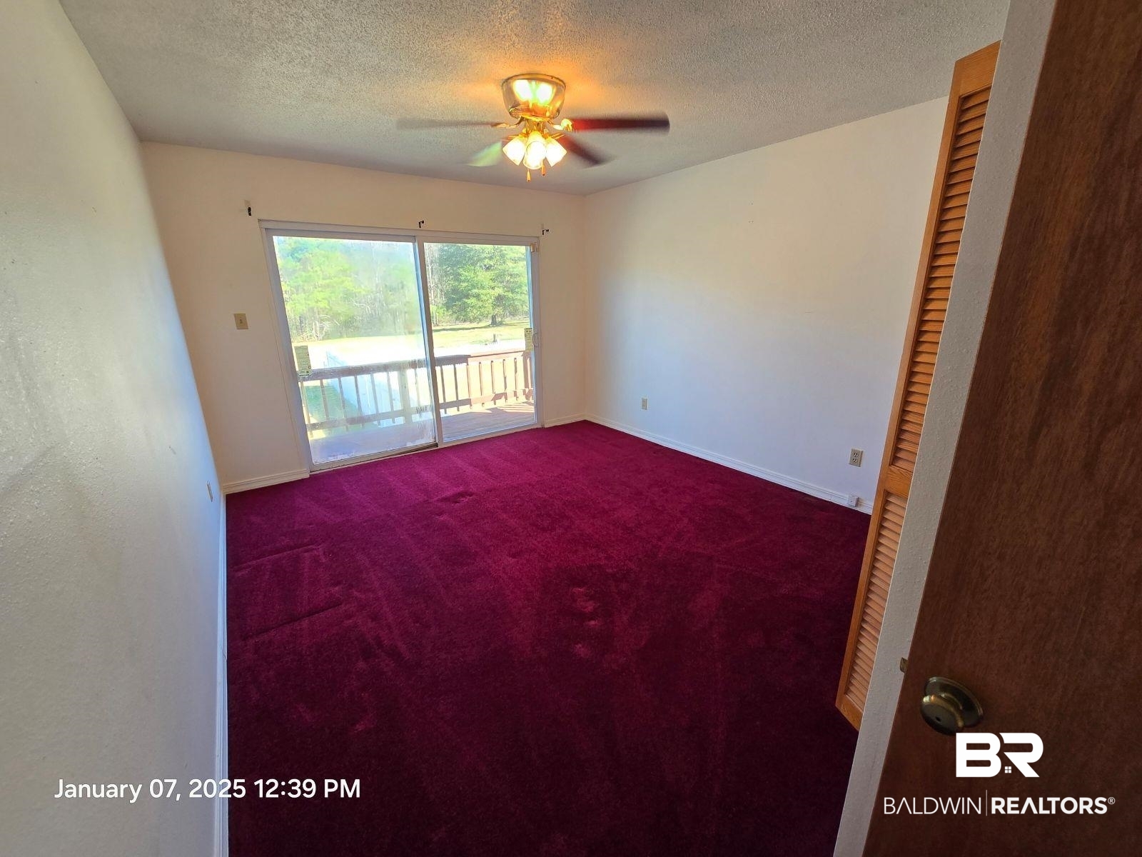 154 Byrd Road Monroeville, AL 36460 - Photo 18 of 26 Carpeted empty room with ceiling fan and a textured ceiling