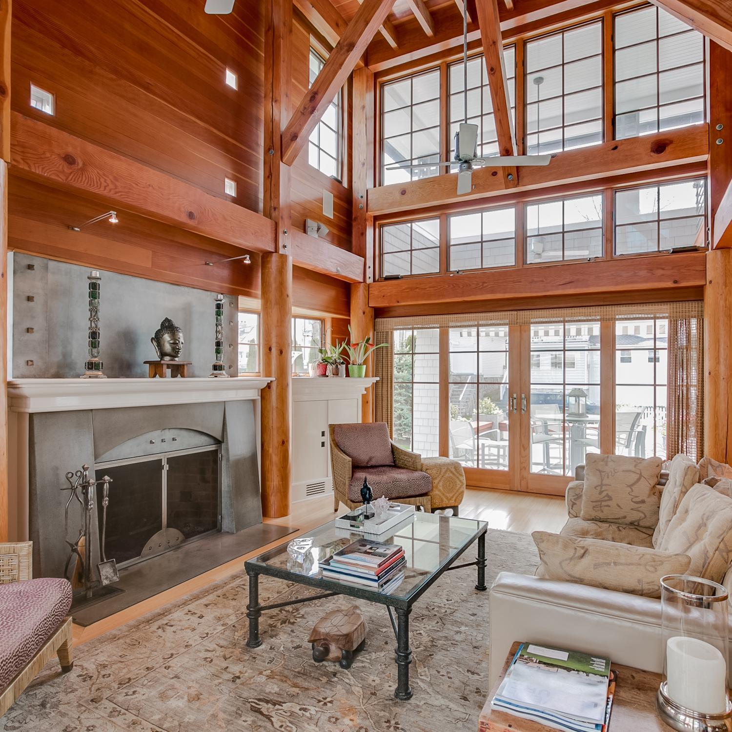 38 Nearwater Road Rowayton, CT 06853 - Photo 19 of 37 a living room with furniture a fireplace and a floor to ceiling window