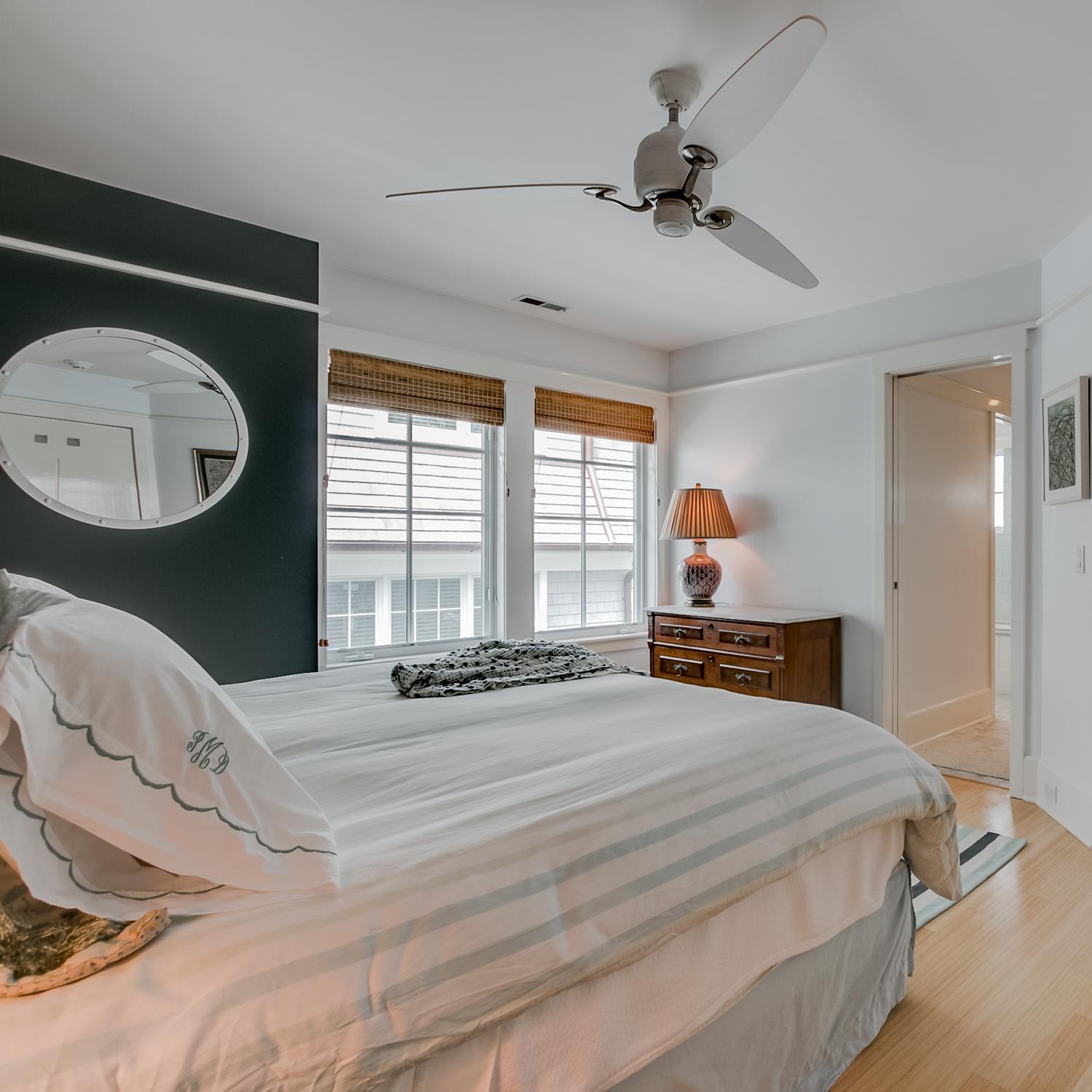 38 Nearwater Road Rowayton, CT 06853 - Photo 27 of 37 a bedroom with a bed and a large mirror