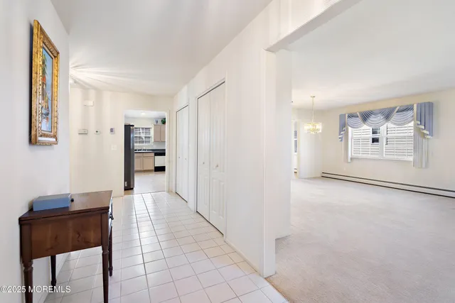 a view of a room with furniture and a window