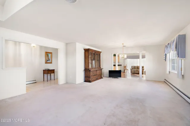 a view of empty room with furniture and cabinet