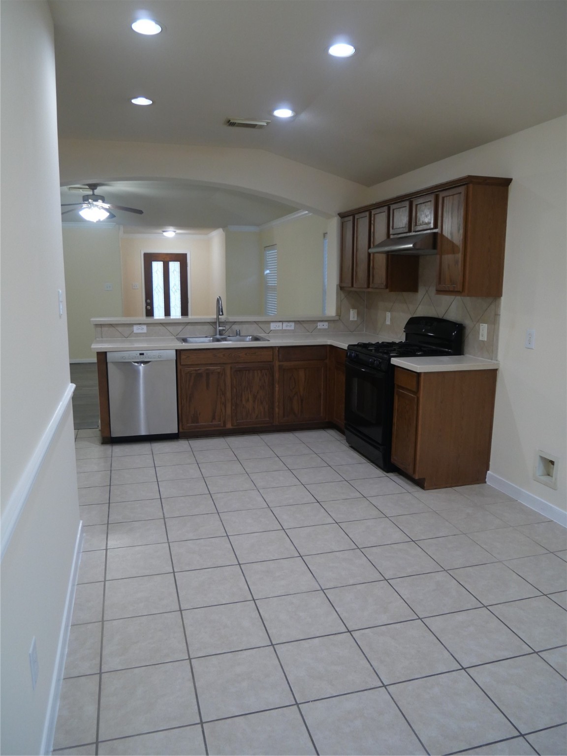 2726 Heatherwind Lane Houston, TX 77047 - Photo 14 of 27 a kitchen with stainless steel appliances granite countertop a stove a sink and a refrigerator