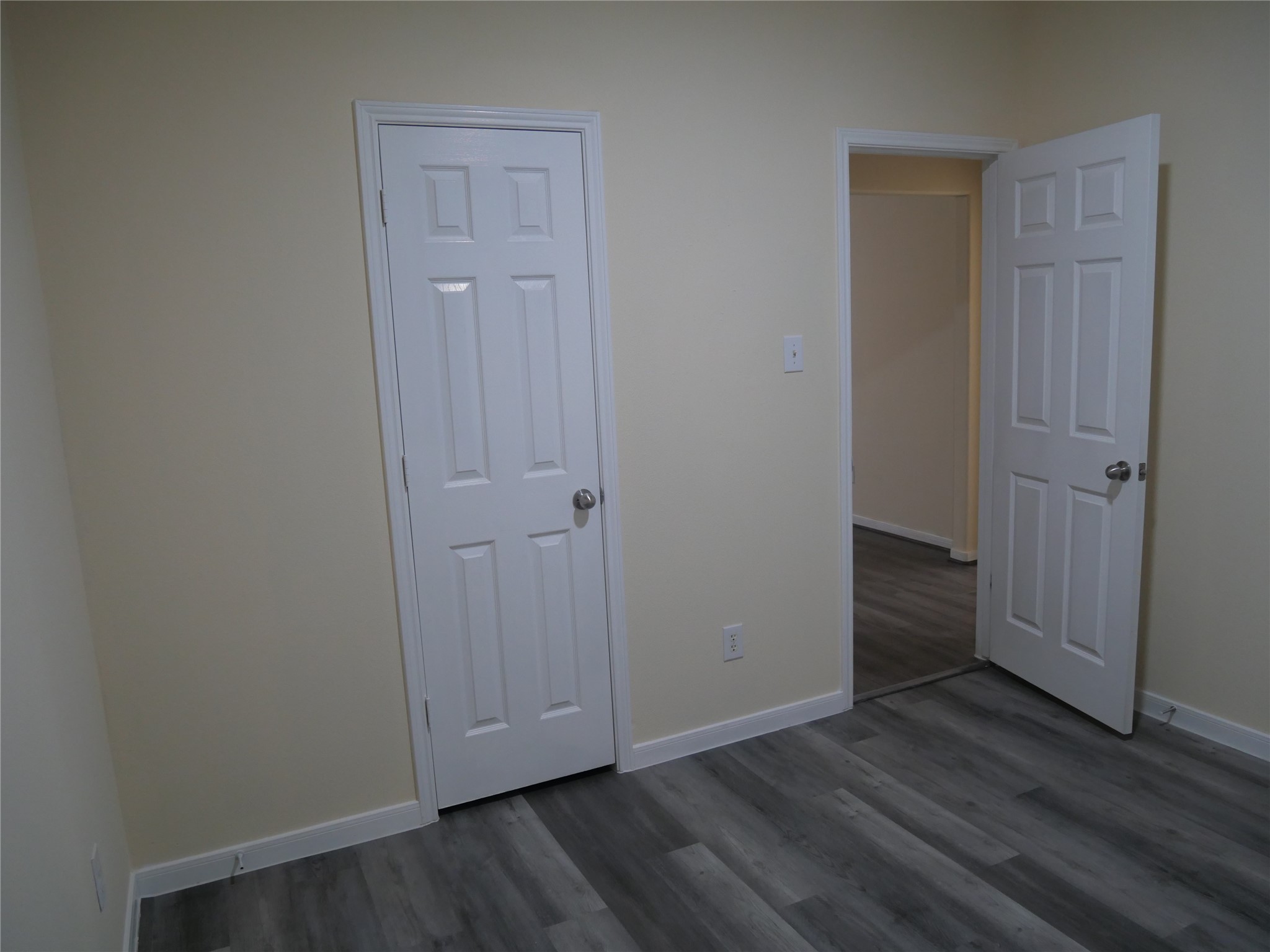 2726 Heatherwind Lane Houston, TX 77047 - Photo 23 of 27 a view of an empty room with wooden floor