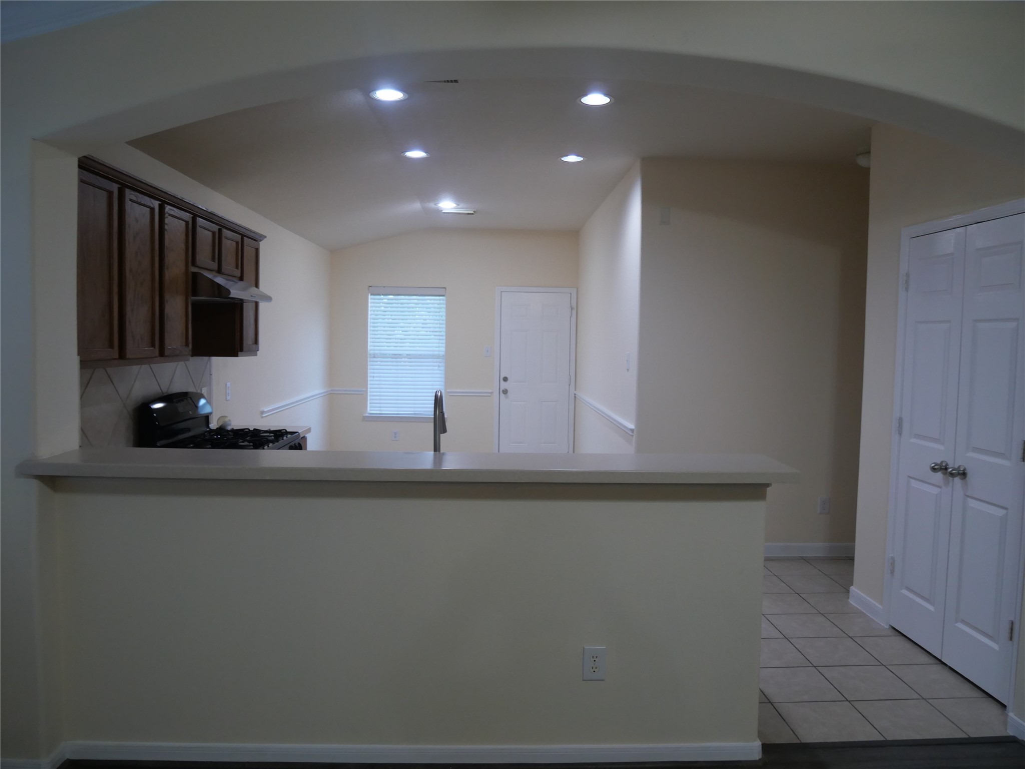 2726 Heatherwind Lane Houston, TX 77047 - Photo 9 of 27 a kitchen with stainless steel appliances a sink a stove cabinets and a refrigerator