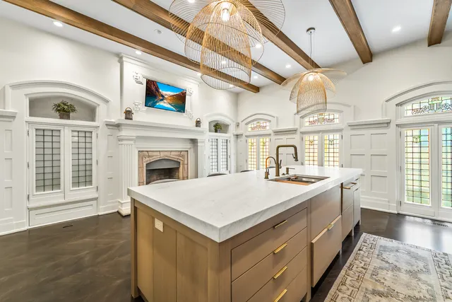 a bath room with a bed furniture and a flat tv screen