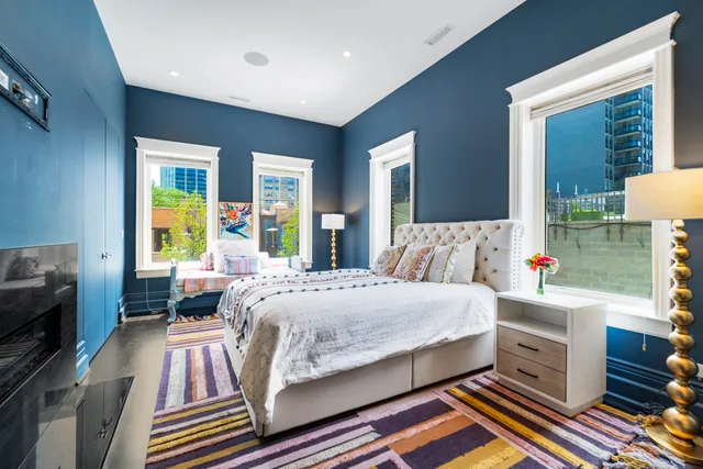 a view of a patio with couches table and chairs and potted plants