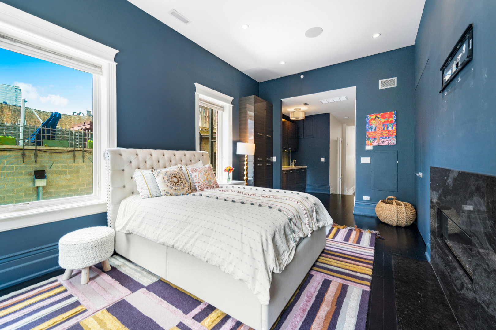 53 East Division Street Chicago, IL 60611 - Photo 47 of 79 a bedroom with a bed and wooden floor