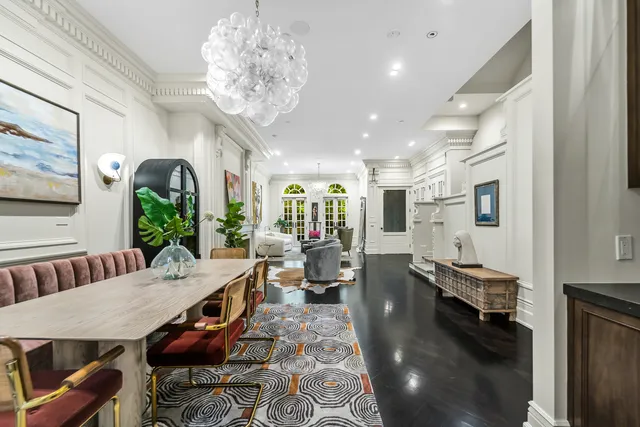 a living room with fireplace furniture and a fireplace