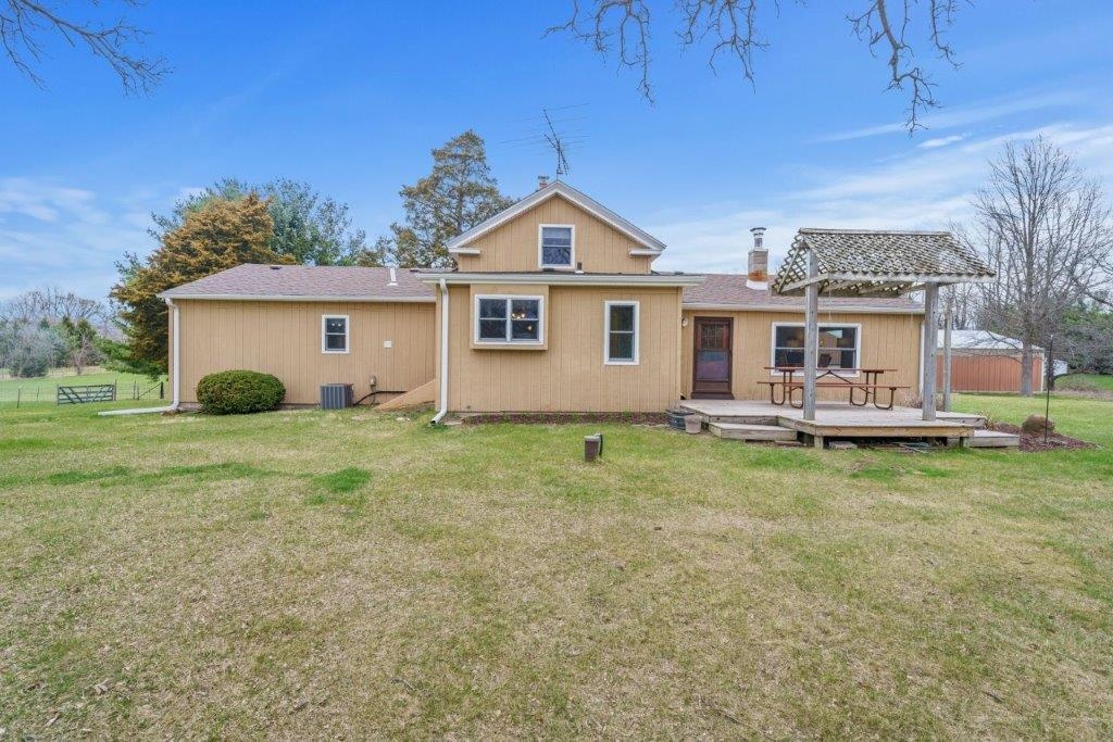 8709 Elevator Road Roscoe, IL 61073 - Photo 2 of 25 a view of a house with a yard patio and fire pit