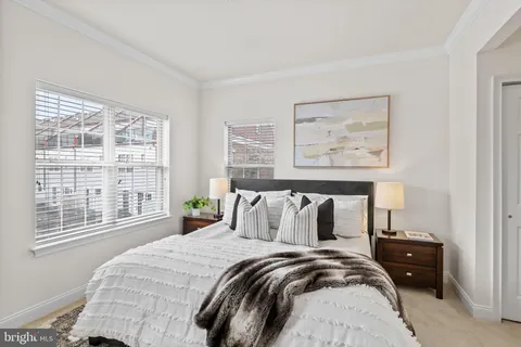 a bed room with a bed and a painting