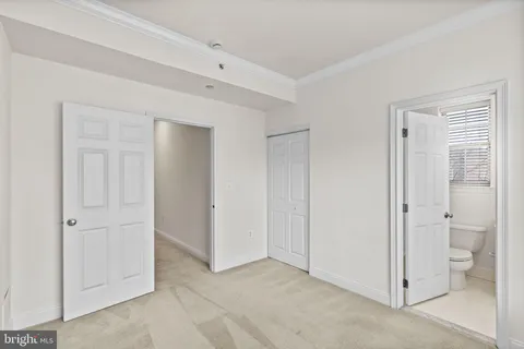 a bathroom with a toilet and a bathtub