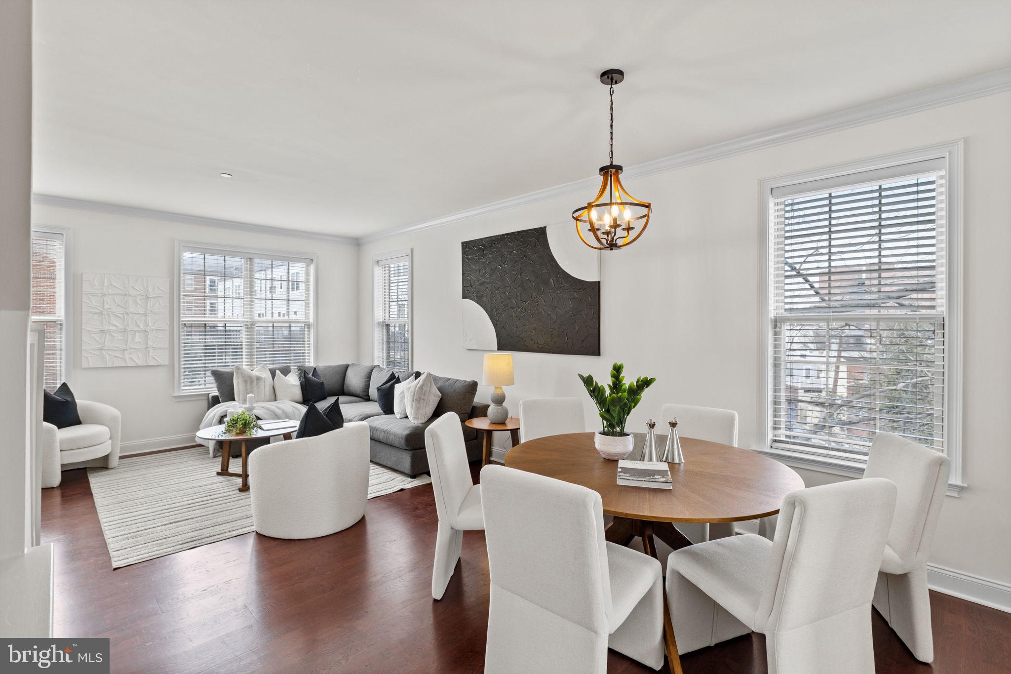 508 Governors Court Philadelphia, PA 19146 - Photo 5 of 54 a living room with couches a dining table and a couches with wooden floor
