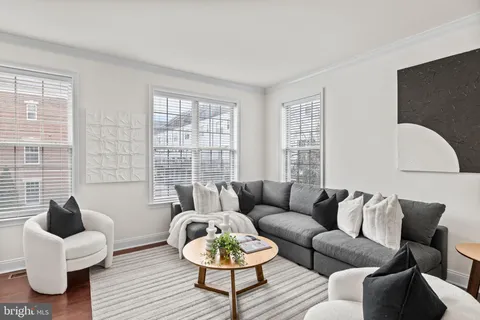 a view of a dining room with furniture wooden floor and chandelier