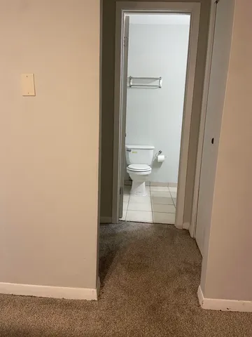 a view of a bathroom with a toilet