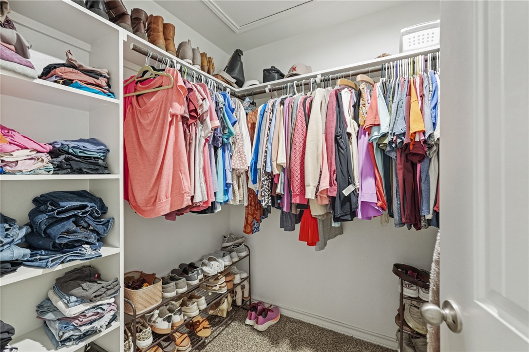 103 Donegal Street Sinton, TX 78387 - Photo 20 of 29 a view of walk in closet with clothes and shoes