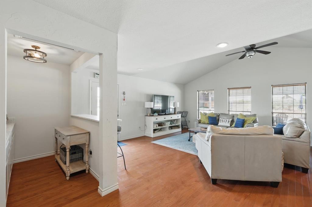 186 West Hells Gate Drive Strawn, TX 76475 - Photo 13 of 40 a living room with furniture a flat screen tv and a window