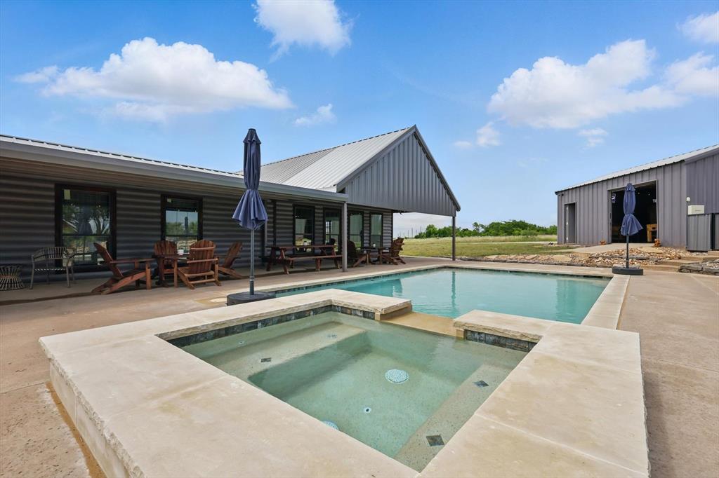 186 West Hells Gate Drive Strawn, TX 76475 - Photo 26 of 40 a view of a patio with swimming pool table and chairs