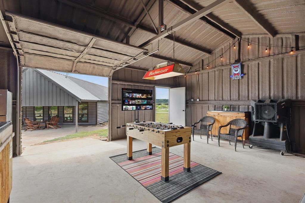 186 West Hells Gate Drive Strawn, TX 76475 - Photo 30 of 40 a outdoor space with lots of furniture and white walls