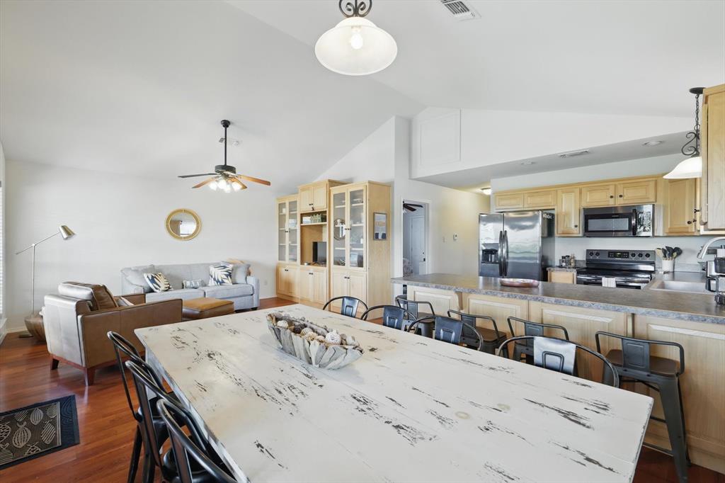 186 West Hells Gate Drive Strawn, TX 76475 - Photo 8 of 40 a view of a dining room kitchen and a dining table chairs