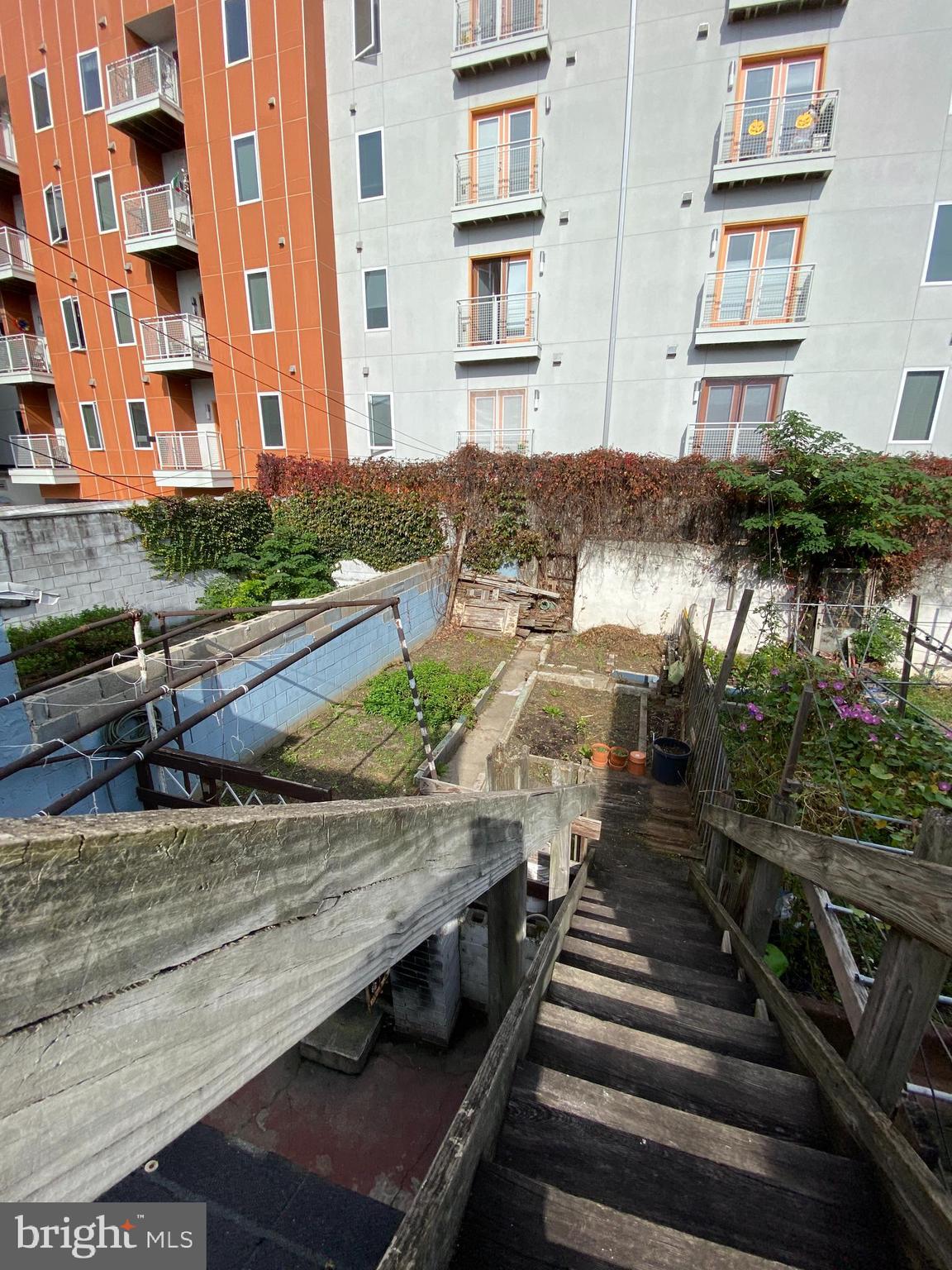 a view of a backyard with swimming pool