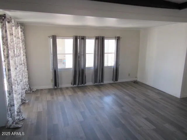 a view of livingroom with hardwood floor and window