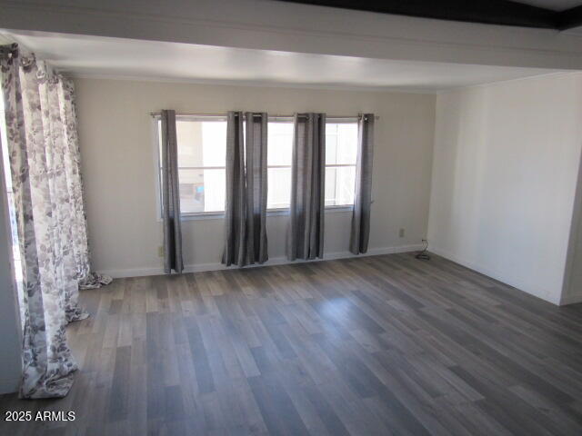 3411 South Camino Seco, Unit 401 Tucson, AZ 85730 - Photo 7 of 17 a view of livingroom with hardwood floor and window