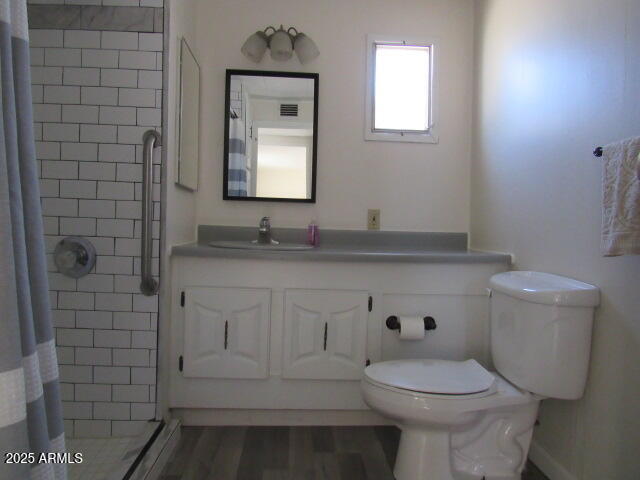 3411 South Camino Seco, Unit 401 Tucson, AZ 85730 - Photo 10 of 17 a bathroom with a sink a toilet and mirror
