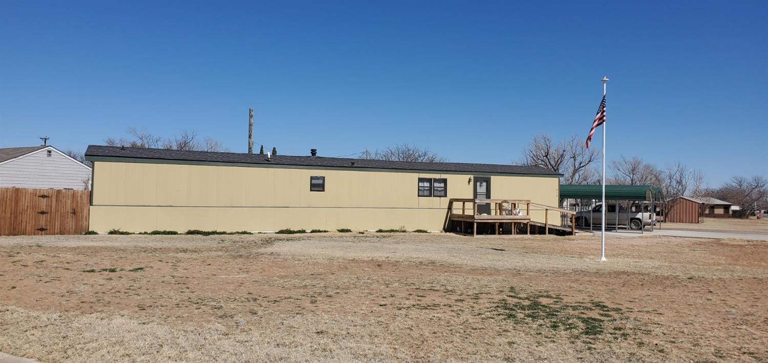 716 West 8th Street Post, TX 79356 - Photo 14 of 14 a view of a house with a snow in the background