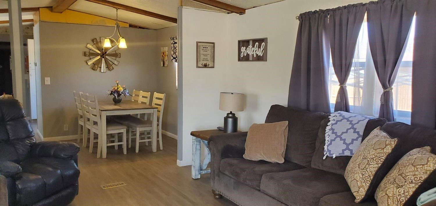 716 West 8th Street Post, TX 79356 - Photo 4 of 14 a living room with furniture and a large window