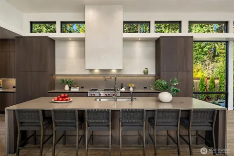 a view of a a dining room with furniture window and wooden floor