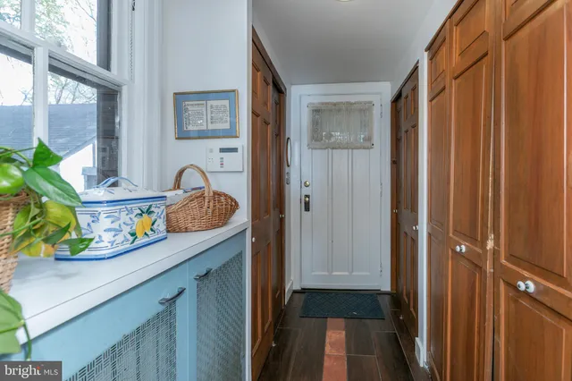 a kitchen with a sink a stove and cabinets