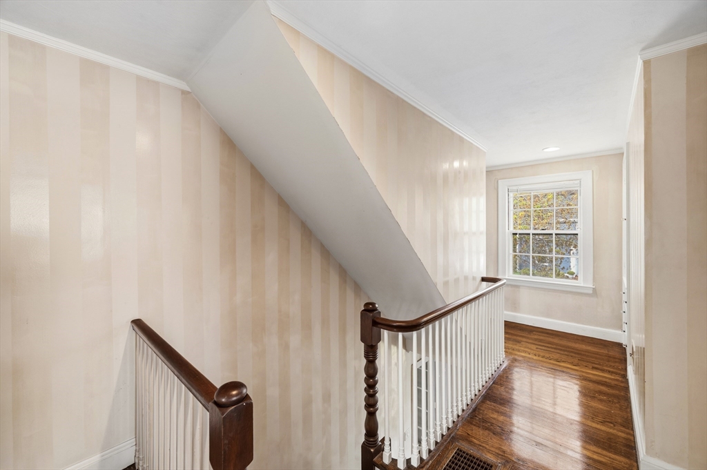 26 Pickwick Road Marblehead, MA 01945 - Photo 22 of 40 a view of entryway with wooden floor and stairs
