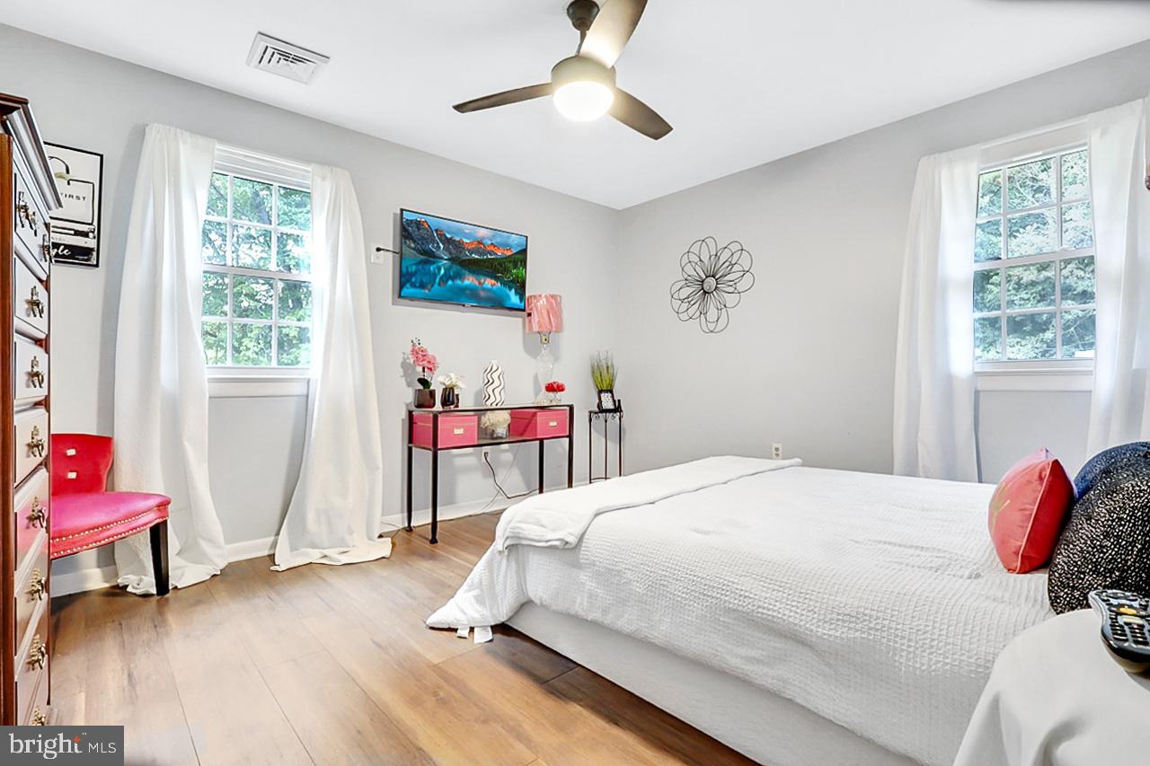 38340 Sugar Hole Road Avenue, MD 20609 - Photo 11 of 32 a bedroom with a bed and a window