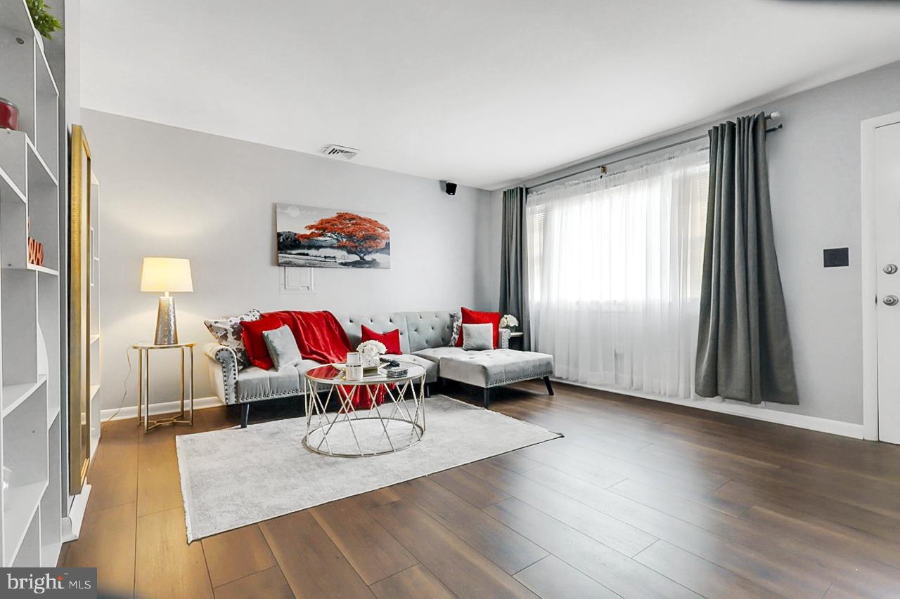 38340 Sugar Hole Road Avenue, MD 20609 - Photo 13 of 32 a living room with furniture and wooden floor
