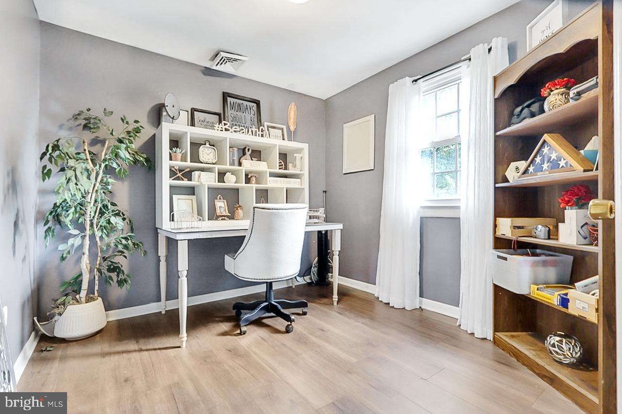 38340 Sugar Hole Road Avenue, MD 20609 - Photo 16 of 32 a view of a workspace with furniture and a window