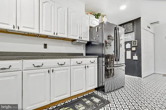a view of cabinets and wooden floor