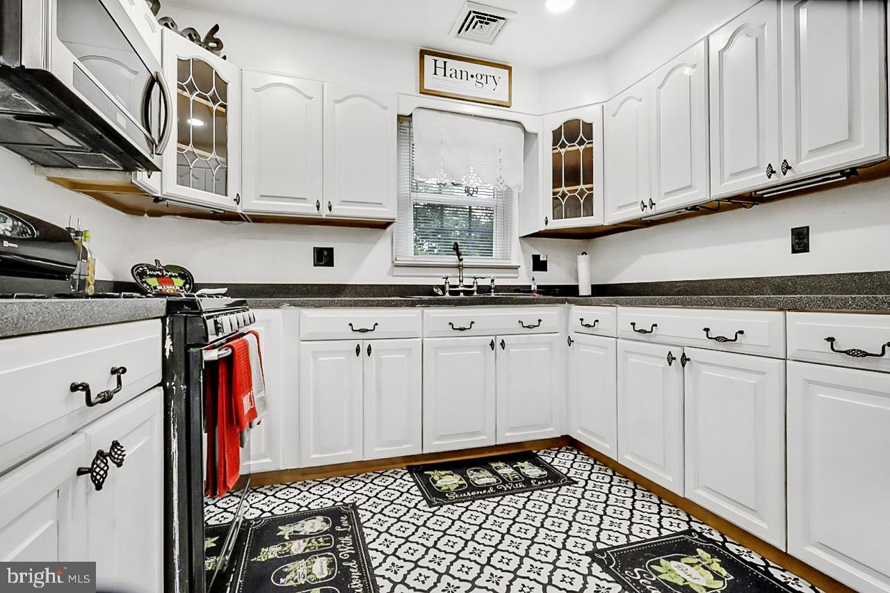 38340 Sugar Hole Road Avenue, MD 20609 - Photo 21 of 32 a view of cabinets and wooden floor