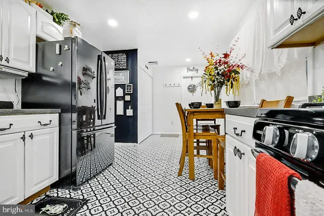 an aerial view of a houses with a yard