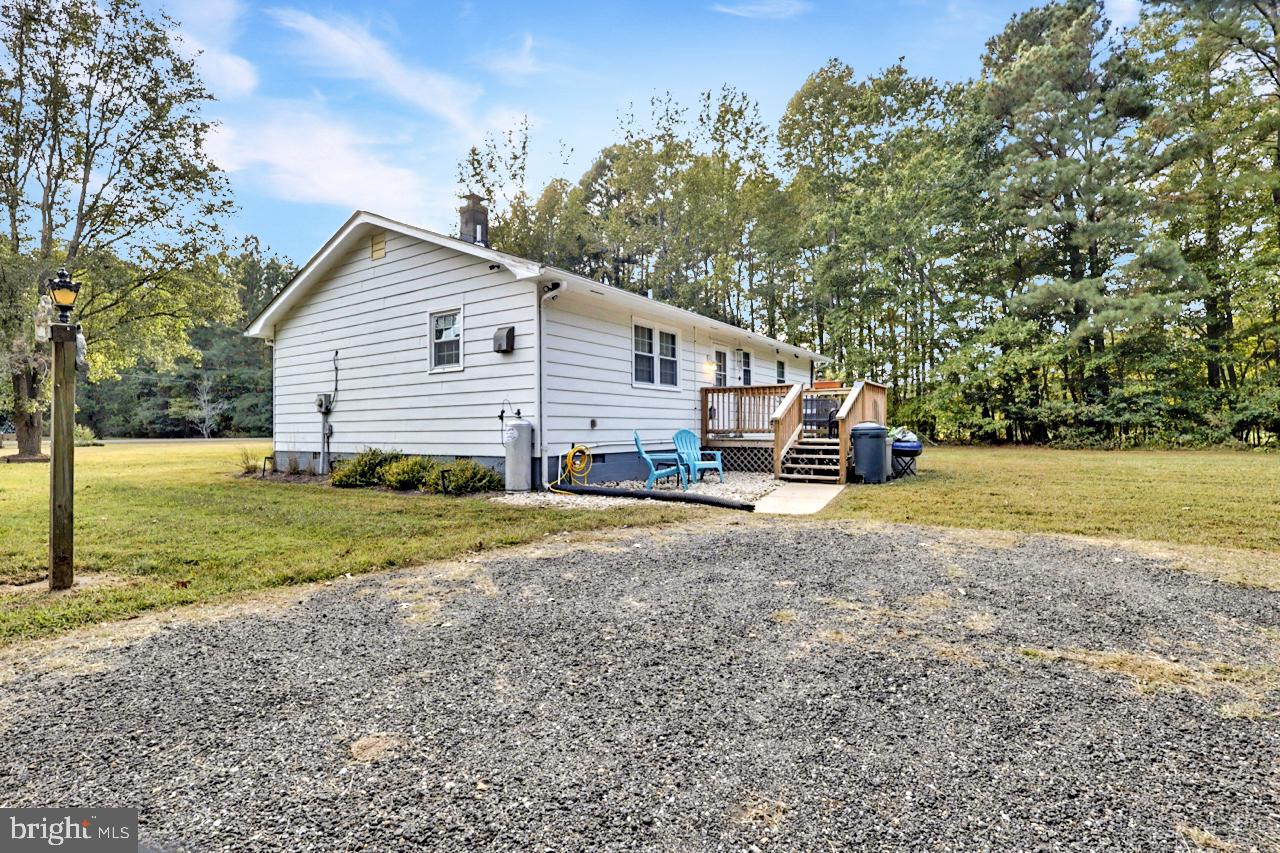 38340 Sugar Hole Road Avenue, MD 20609 - Photo 26 of 32 a view of a house with backyard and trees