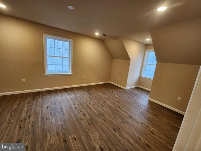 a bathroom with a toilet a sink and a mirror